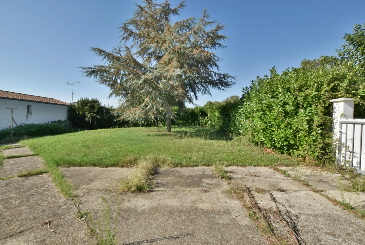 Maison plain-pied centre ville avec jardin et garage 