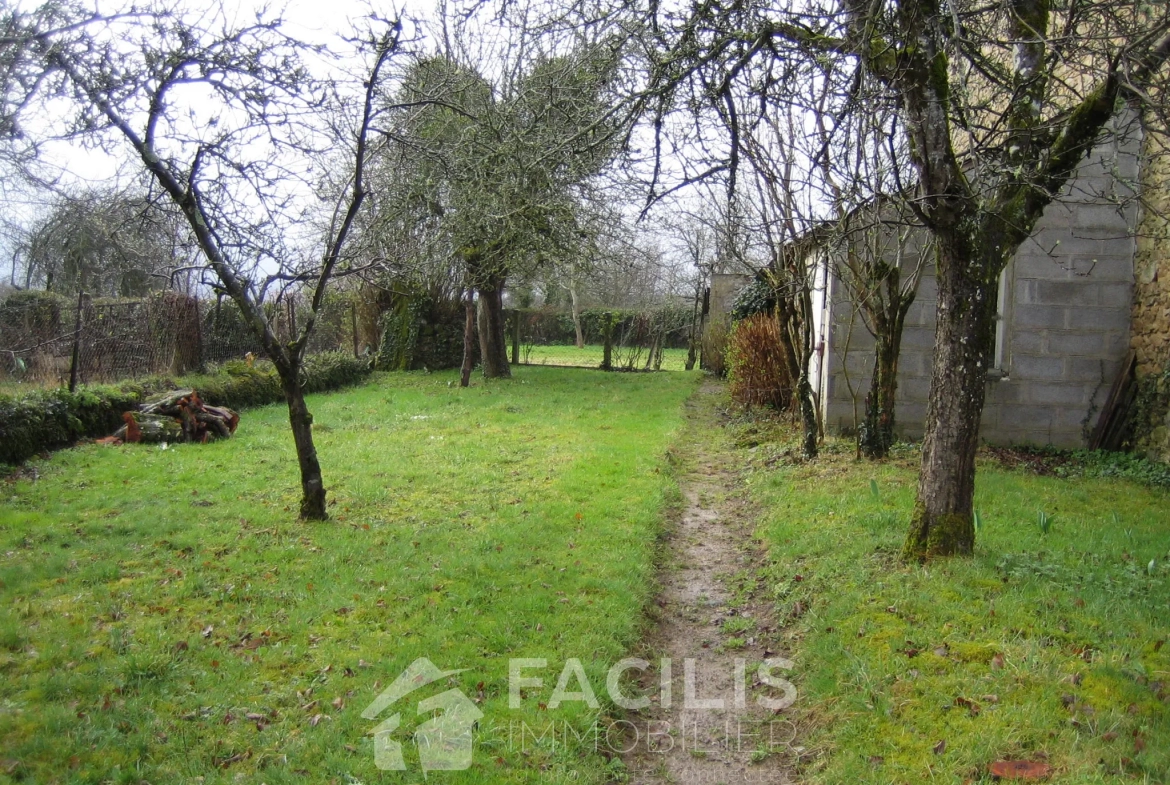 Maison avec trois chambres et terrain 