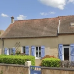 Maison en bon état sur beau terrain arboré