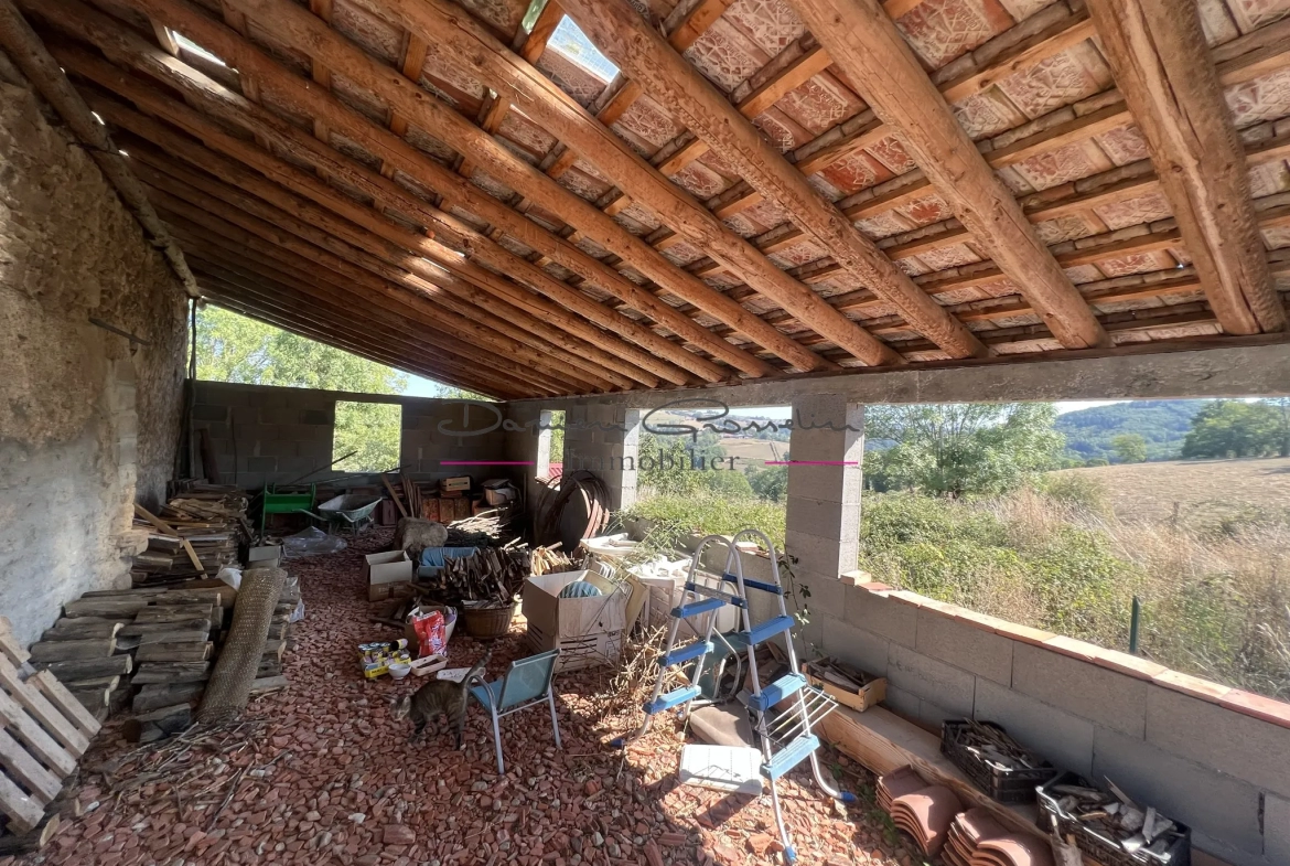 Maison avec dépendance et terrain à Bourg de Thizy 