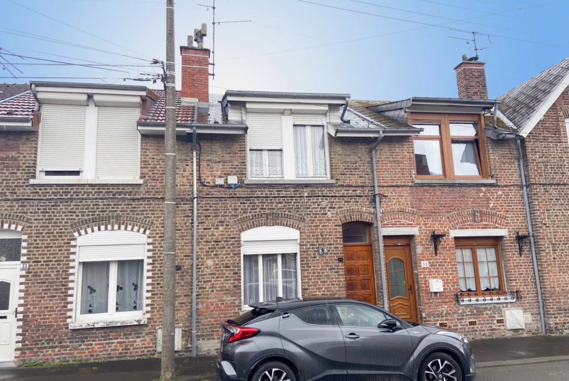 Maison en brique avec jardin et garage potentiel à Boussois 