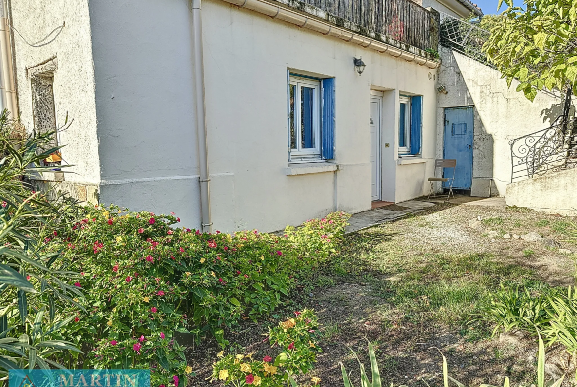 Vente d'un appartement T2 avec jardinet et place de parking à Ceret 