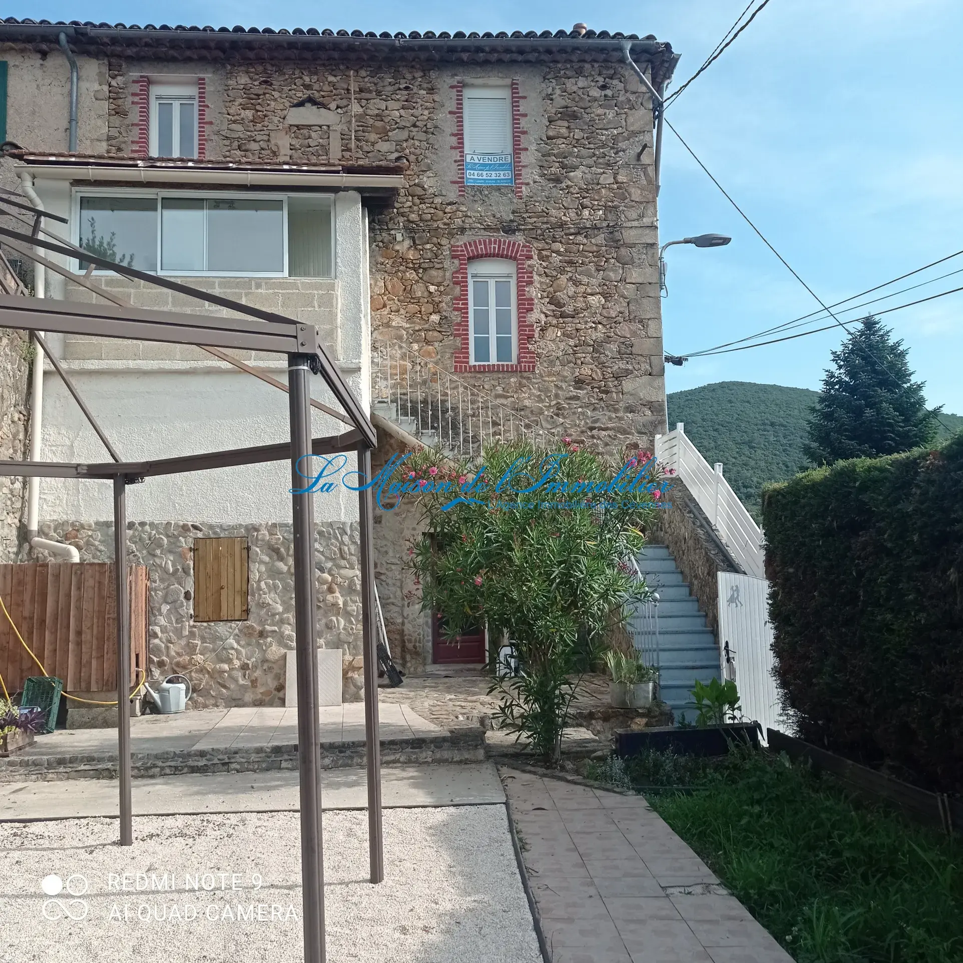 Maison de village en pierres avec jardin à St Florent sur Auzonnet 